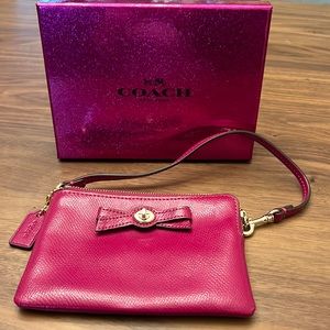 Beautiful COACH Cranberry Turnlock Bow Wristlet
